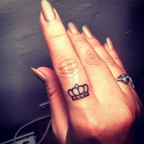 crown tattoo on finger meaning.